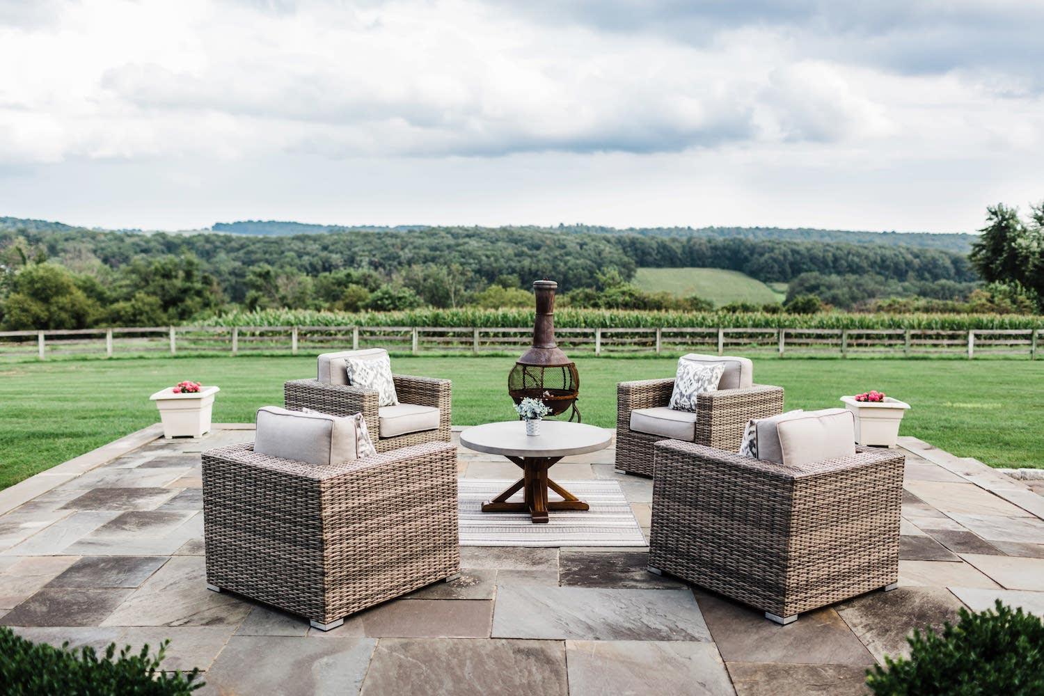The stone terrace with lounge chairs overlooking the valley